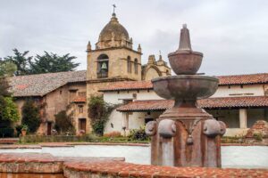 a historic building with a fountain | cherry hill plumbing history