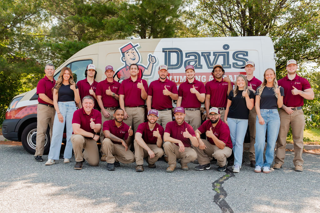 the Davis Plumbing and Drain team stands in front of a branded vehicle, ready to deliver expert plumbing services in Burlington and throughout South Jersey